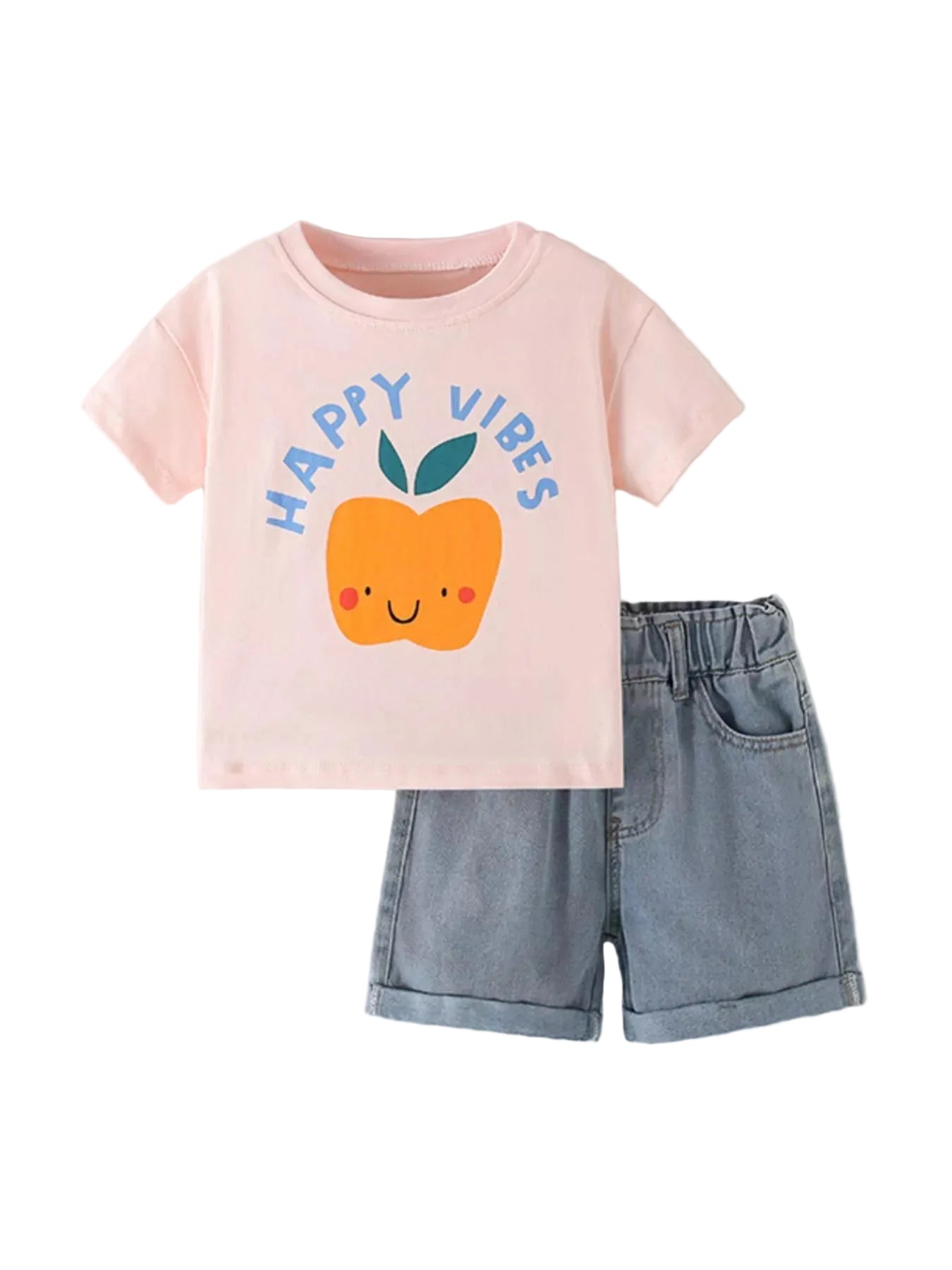 Pink t-shirt with 'Happy Vibes' and peach graphic, paired with denim shorts on a light gray background