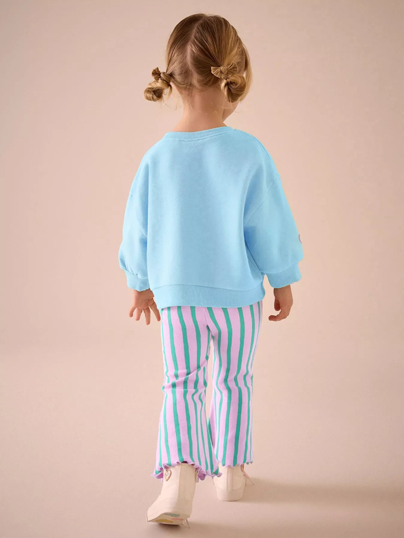 Girl Wearing Turtle Sweater and Stripped Pants 