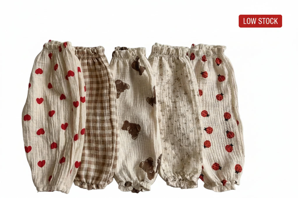 Set of baby bloomers with different patterns on a light gray background