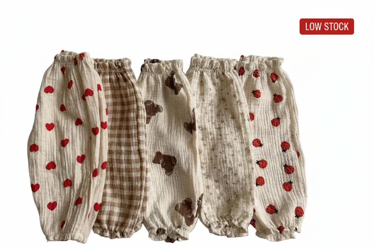 Set of baby bloomers with different patterns on a light gray background