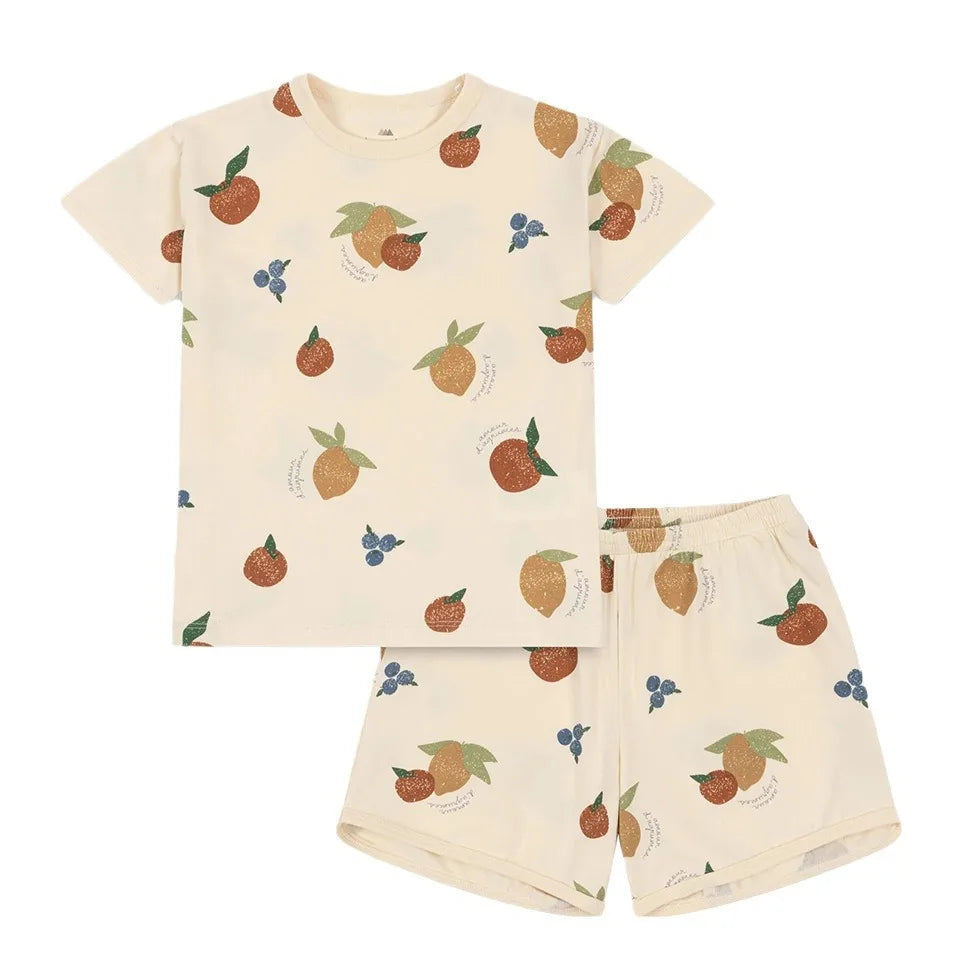 Children's pajama set with fruit pattern on a white background
