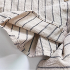 Close-up of a striped fabric garment on a white background