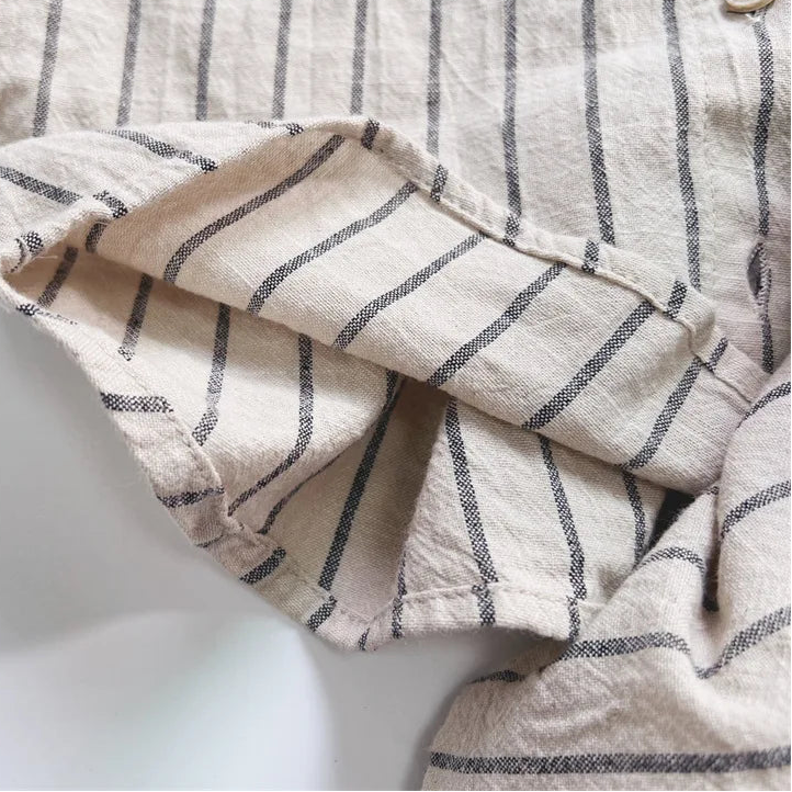 Close-up of a striped fabric garment on a white background