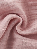Close-up of pink fabric with a soft texture