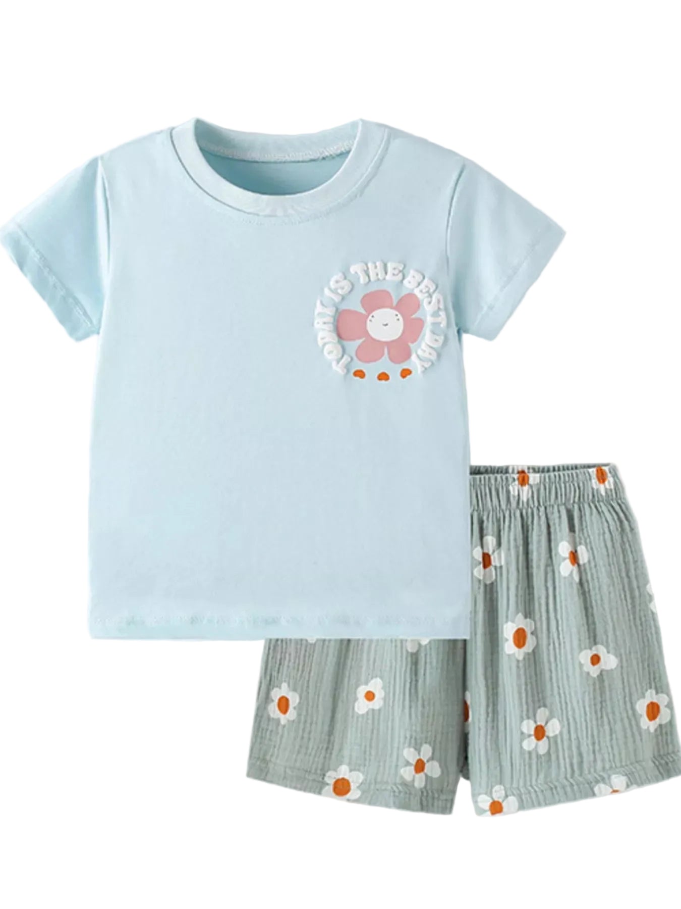 Children's light blue t-shirt with floral design and green shorts with floral patterns on a white background